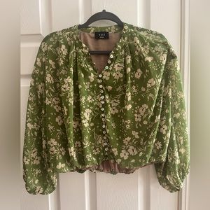 Beautiful green and white floral blouse. Made by Vici, size small